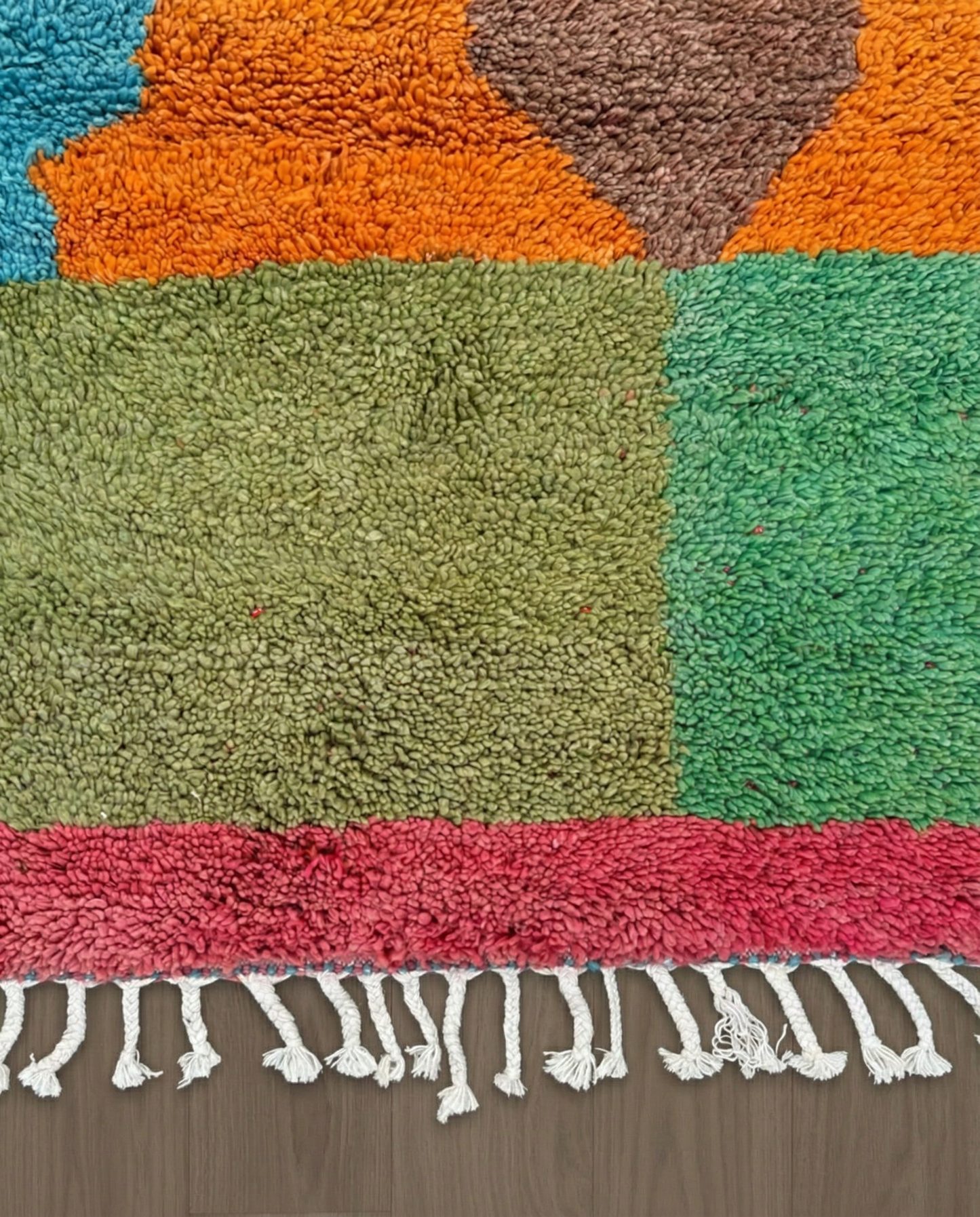 HANAE Beni Ourain orange abstract color block Moroccan rug close-up of hand-tied fringe and kilim band detail, by NURA