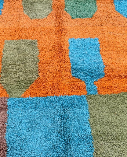 HANAE Beni Ourain orange abstract color block Moroccan rug close-up showing hand-knotted wool texture and pile detail 1, by NURA