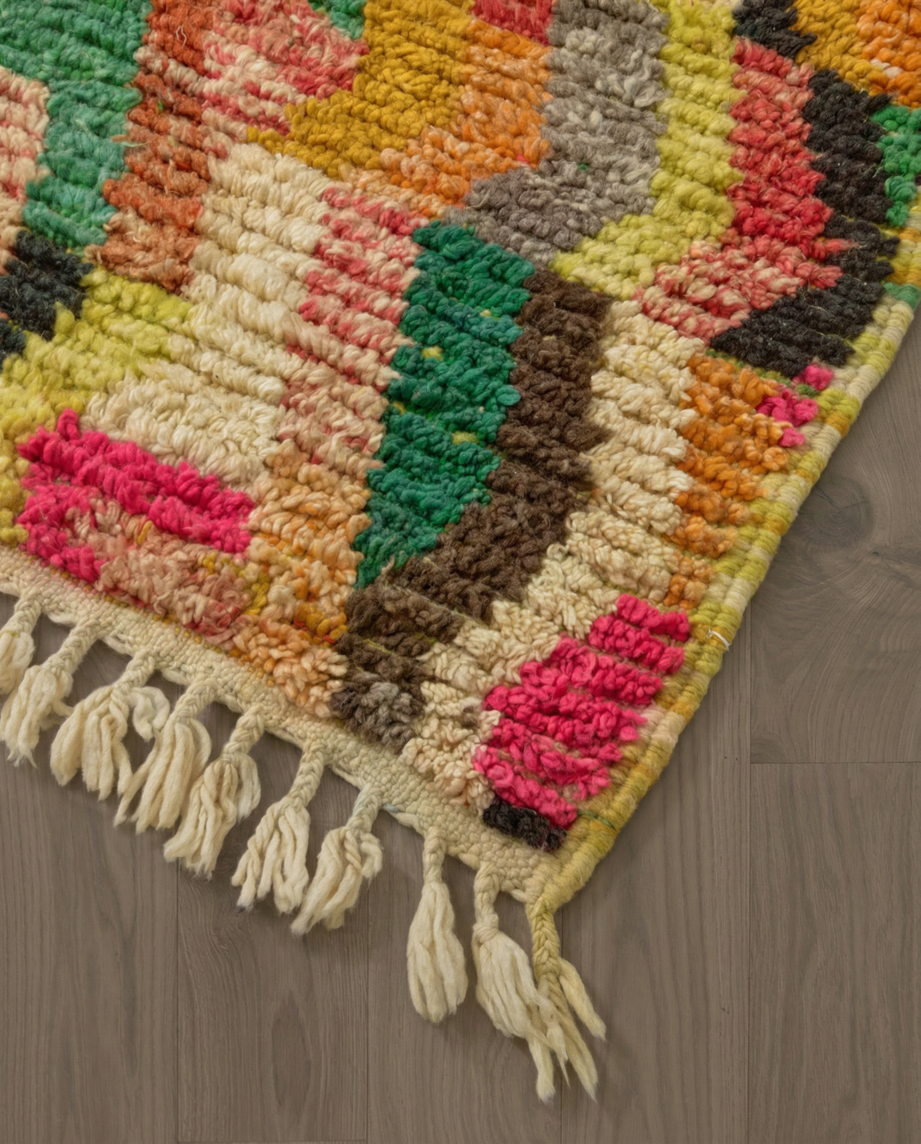 HANAN Azilal hot pink abstract zigzag bands Moroccan rug close-up of hand-tied fringe and kilim band detail, by NURA