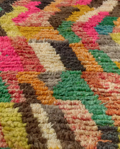 HANAN Azilal hot pink abstract zigzag bands Moroccan rug close-up showing hand-knotted wool texture and pile detail, by NURA