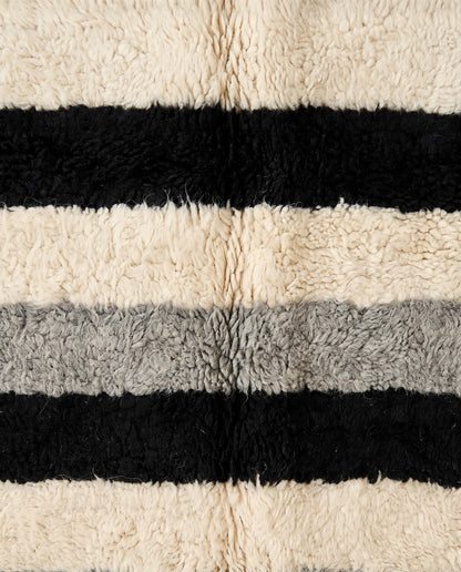 HANIYA Beni Ourain black color block Moroccan rug close-up showing hand-knotted wool texture and pile detail, by NURA