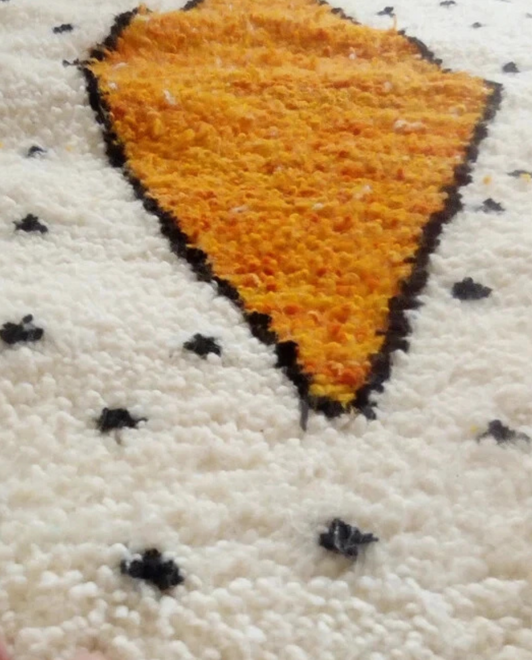 HIBA Mrirt cream bold abstract field Moroccan rug close-up showing hand-knotted wool texture and pile detail, by NURA