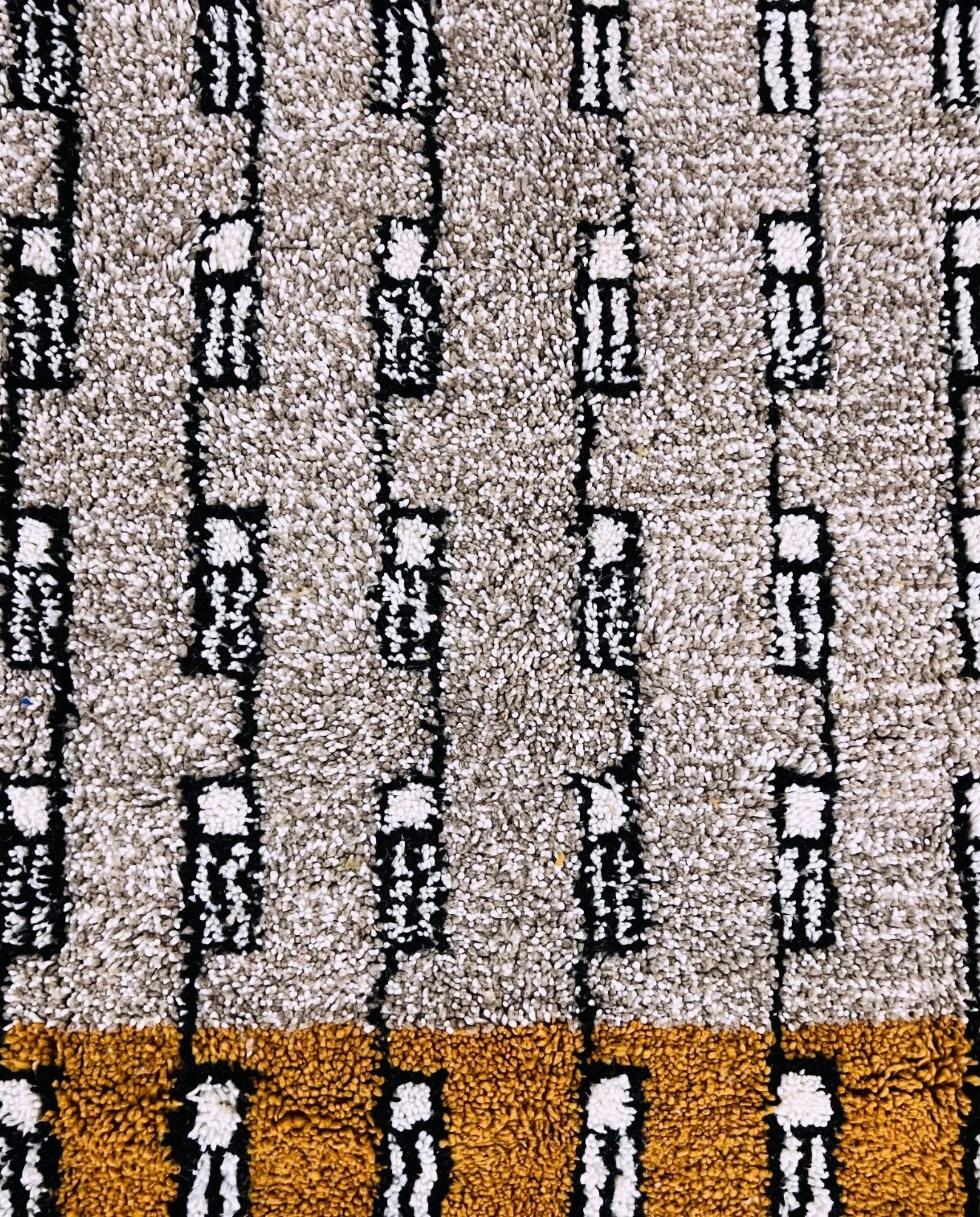 HOUDA Beni Ourain mustard banded geometric field Moroccan rug close-up showing hand-knotted wool texture and pile detail 1, by NURA