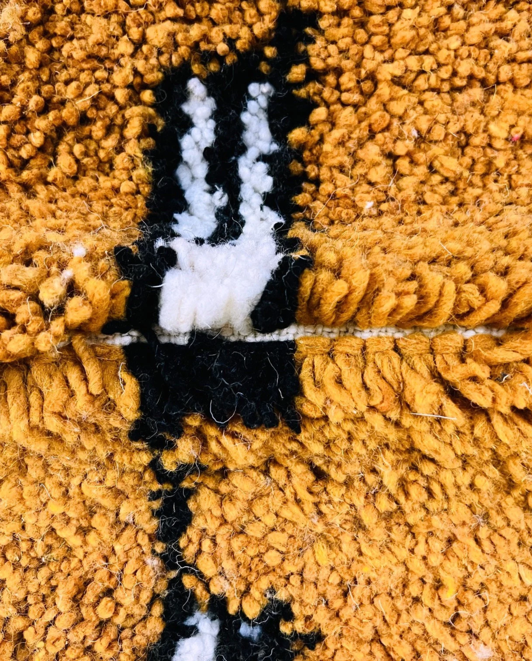 HOUDA Beni Ourain mustard banded geometric field Moroccan rug close-up showing hand-knotted wool texture and pile detail 2, by NURA