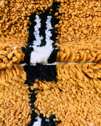 HOUDA Beni Ourain mustard banded geometric field Moroccan rug close-up showing hand-knotted wool texture and pile detail 2, by NURA