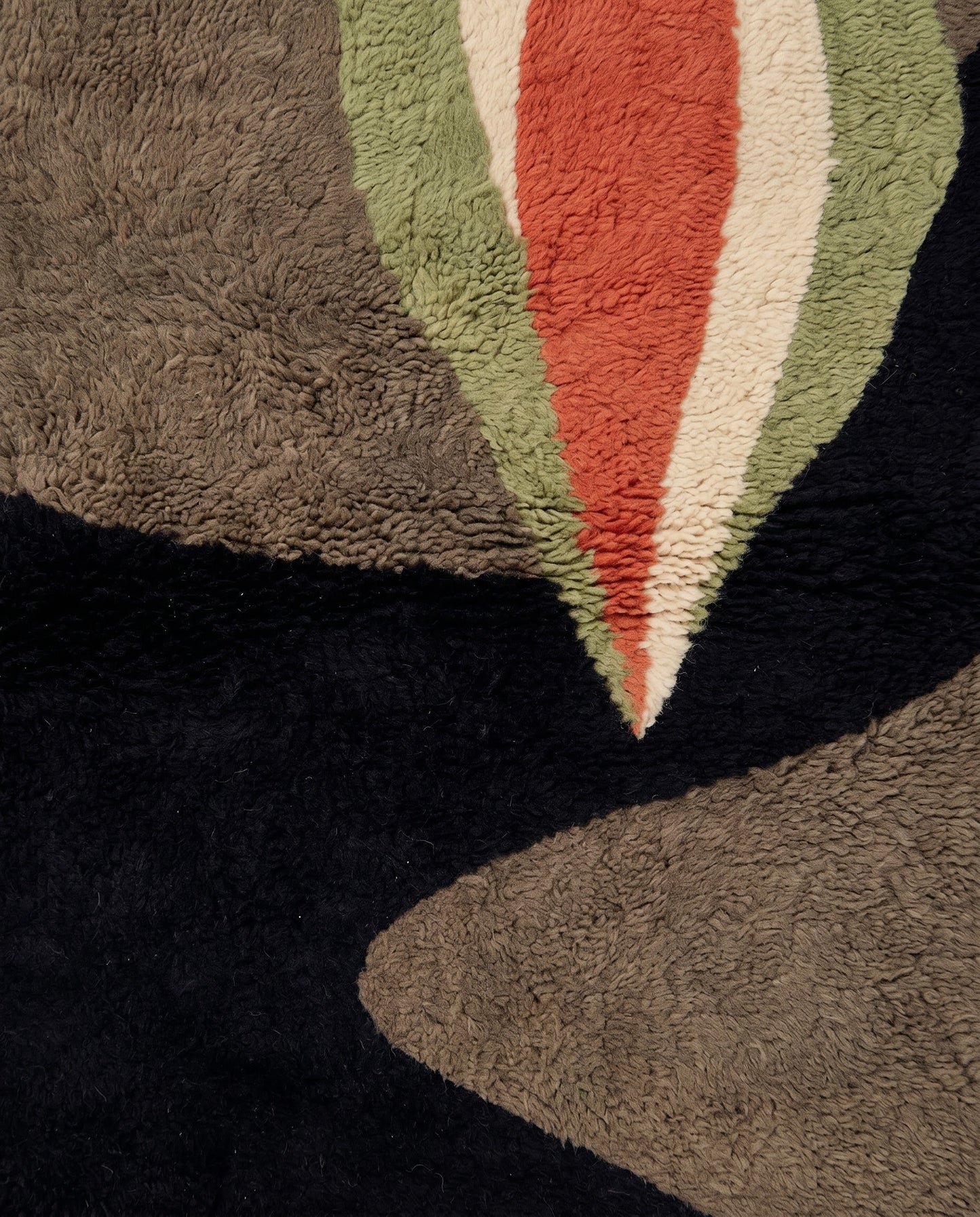 HOURIA Mrirt black organic abstract Moroccan rug close-up showing hand-knotted wool texture and pile detail, by NURA