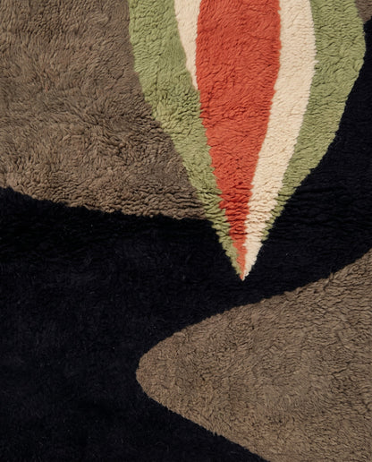 HOURIA Mrirt black organic abstract Moroccan rug close-up showing hand-knotted wool texture and pile detail, by NURA