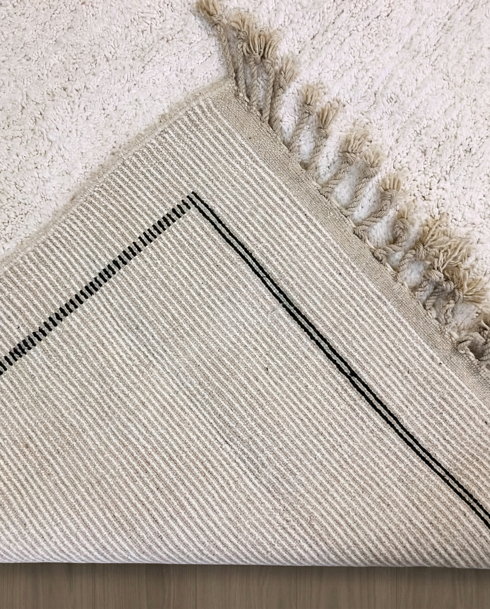 IKRAM Beni Ourain ivory solid border Moroccan rug back view showing traditional handwoven construction, by NURA