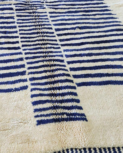 INES Beni Ourain cream striped central medallion Moroccan rug close-up showing hand-knotted wool texture and pile detail 2, by NURA