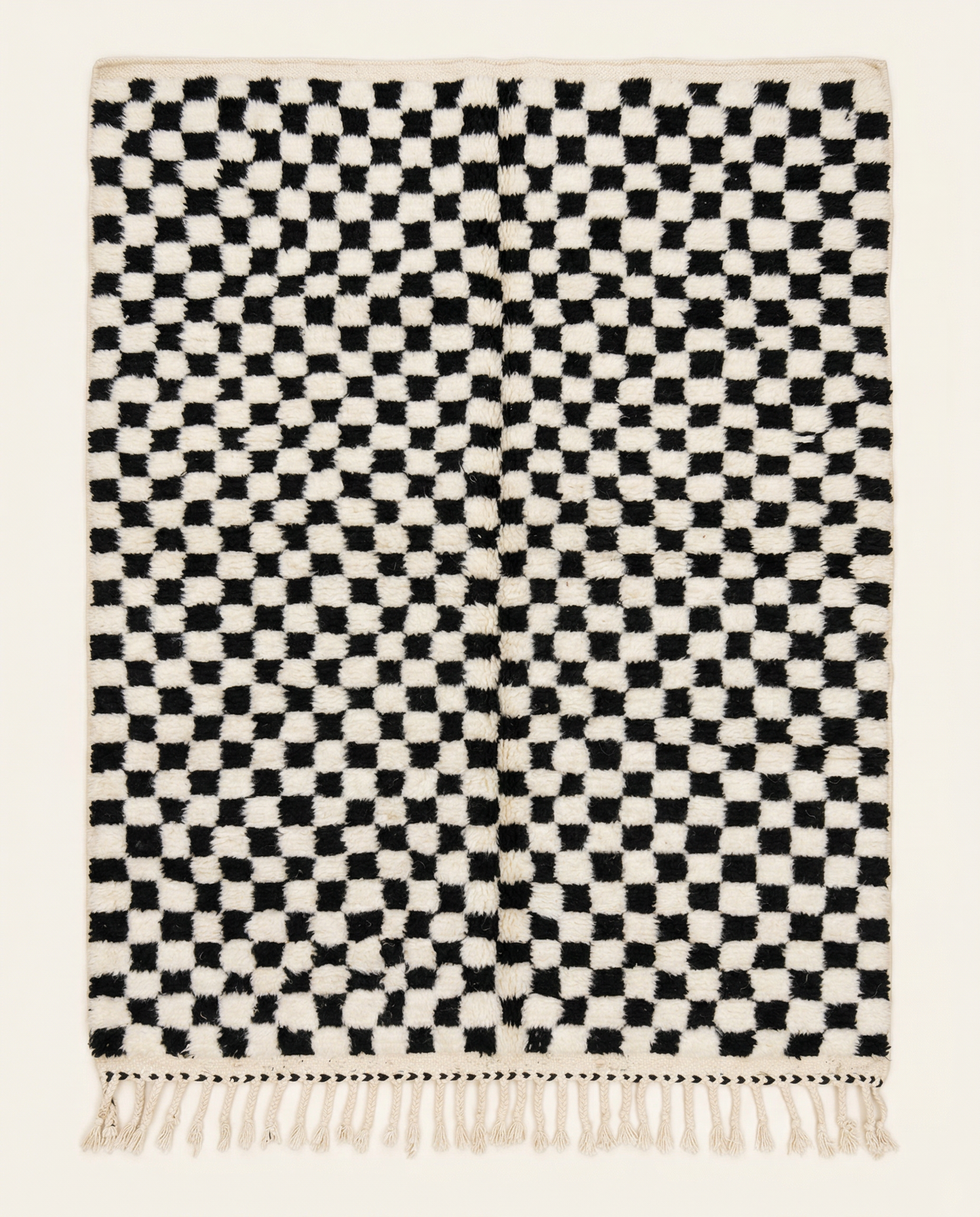 Plush ivory Beni Ourain Moroccan rug with a bold black checker grid and a natural wool high pile, by NURA.