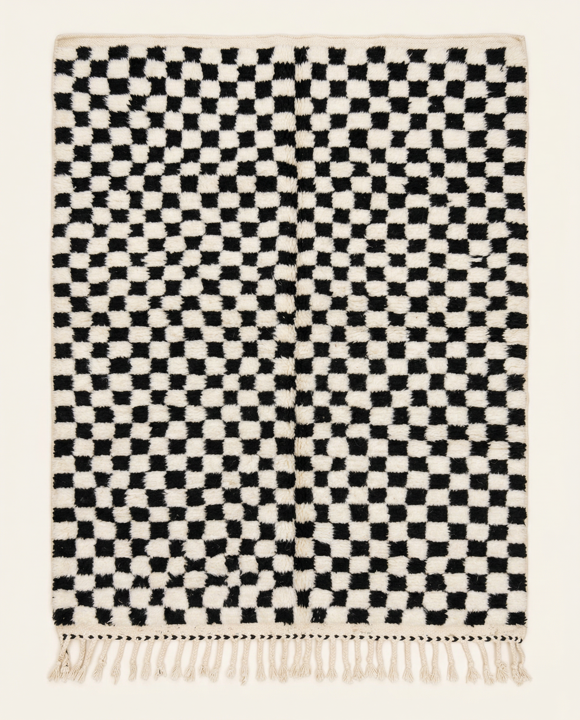 Plush ivory Beni Ourain Moroccan rug with a bold black checker grid and a natural wool high pile, by NURA.