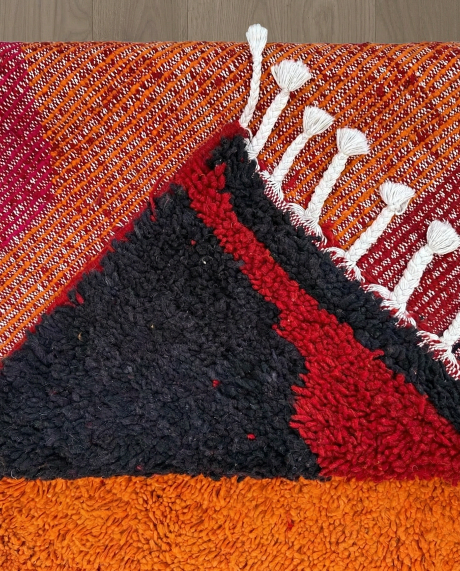JANA Azilal orange abstract color block Moroccan rug back view showing traditional handwoven construction, by NURA