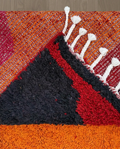 JANA Azilal orange abstract color block Moroccan rug back view showing traditional handwoven construction, by NURA