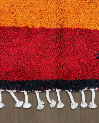 JANA Azilal orange abstract color block Moroccan rug close-up of hand-tied fringe and kilim band detail, by NURA