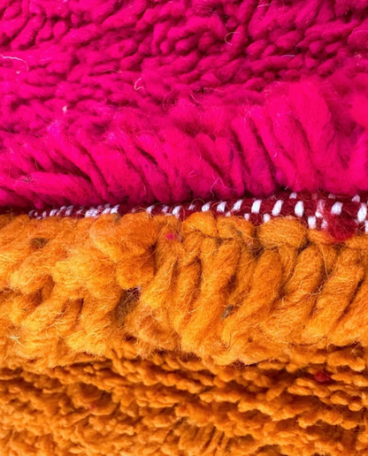 JANA Azilal orange abstract color block Moroccan rug close-up showing hand-knotted wool texture and pile detail 2, by NURA