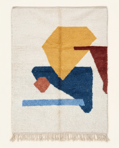 Plush cream Azilal Moroccan rug with bold abstract color blocks in cobalt, yellow, and rust, by NURA.