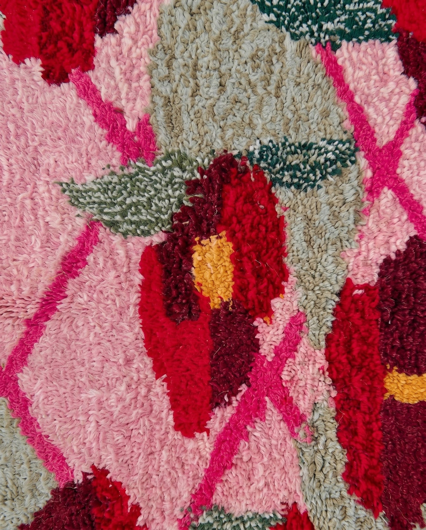 JORIA Boujad pink diamond lattice Moroccan rug close-up showing hand-knotted wool texture and pile detail, by NURA