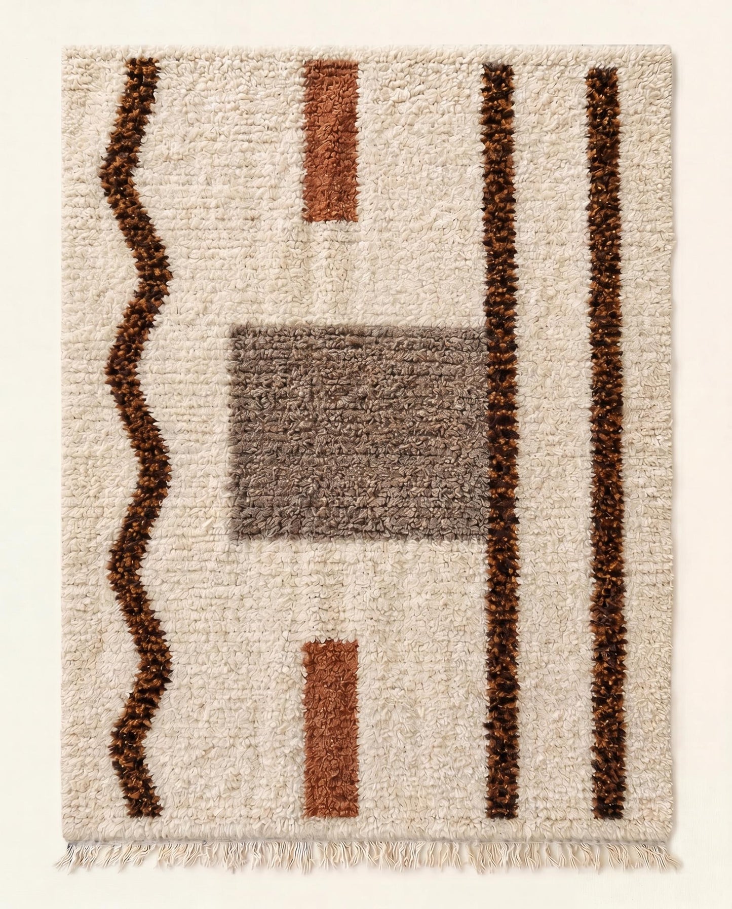 Plush Beni Ourain Moroccan rug with an abstract design of brown lines and grey blocks on a cream wool field by NURA.