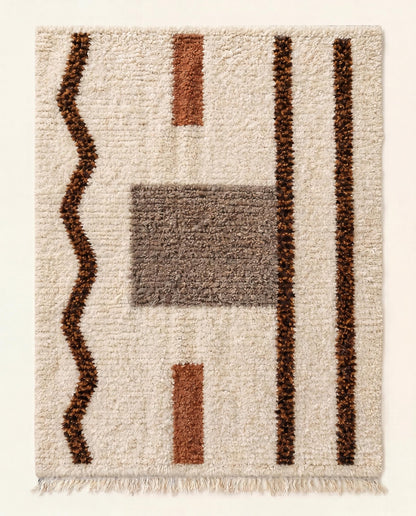 Plush Beni Ourain Moroccan rug with an abstract design of brown lines and grey blocks on a cream wool field by NURA.