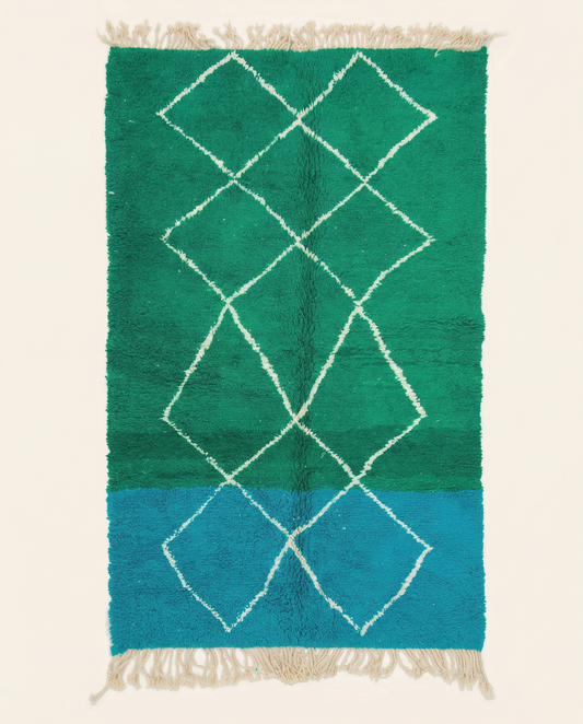 Plush emerald green and cobalt blue Azilal Moroccan rug with a bold white diamond lattice and high pile, by NURA.