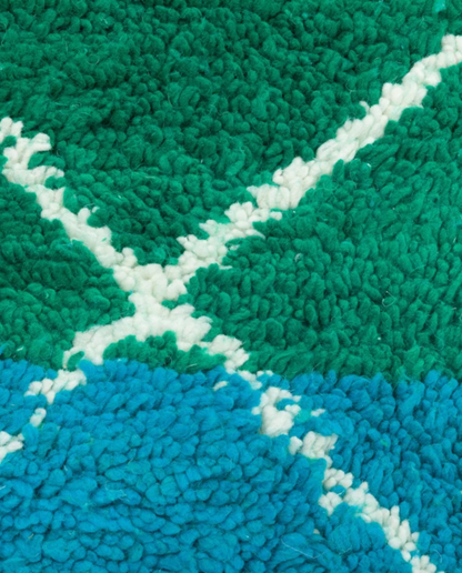 JOUHARA Azilal emerald two-tone diamond lattice Moroccan rug close-up showing hand-knotted wool texture and pile detail, by NURA