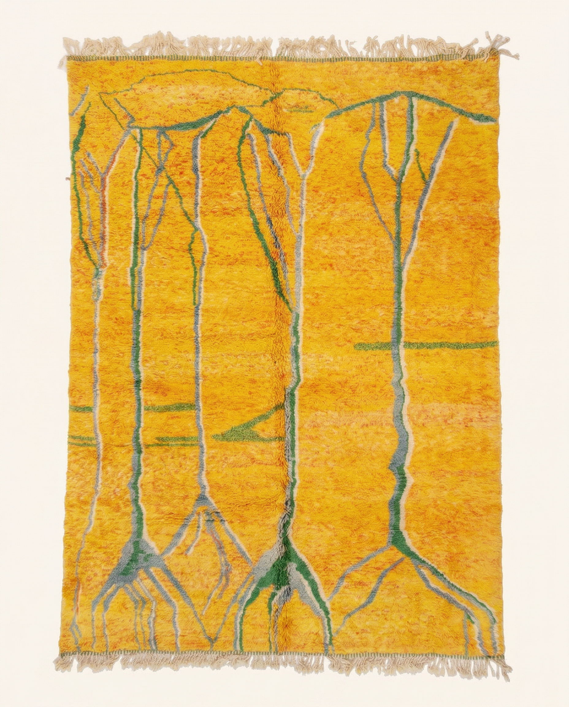 Plush saffron yellow Azilal Moroccan rug with bold abstract green branching motifs and a thick natural wool pile, by NURA.