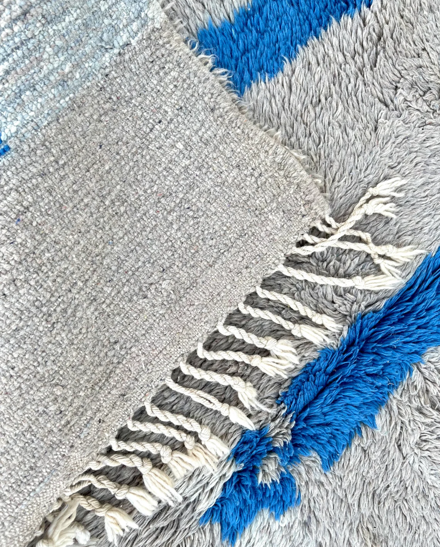 KAOUTAR Beni Ourain grey bold abstract motifs Moroccan rug back view showing traditional handwoven construction, by NURA