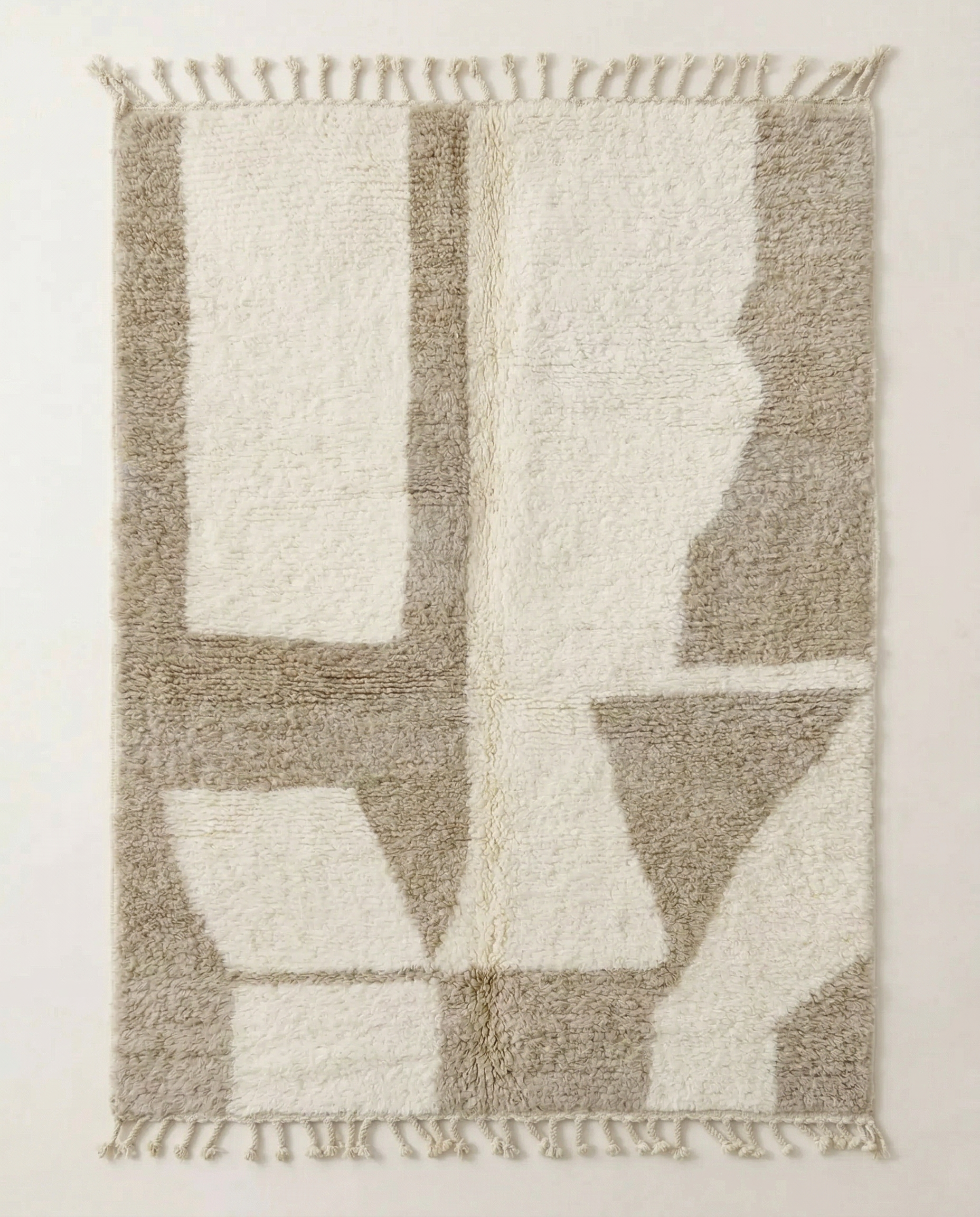 Plush cream Beni Ourain Moroccan rug with large abstract geometric blocks in soft beige and high pile, by NURA.