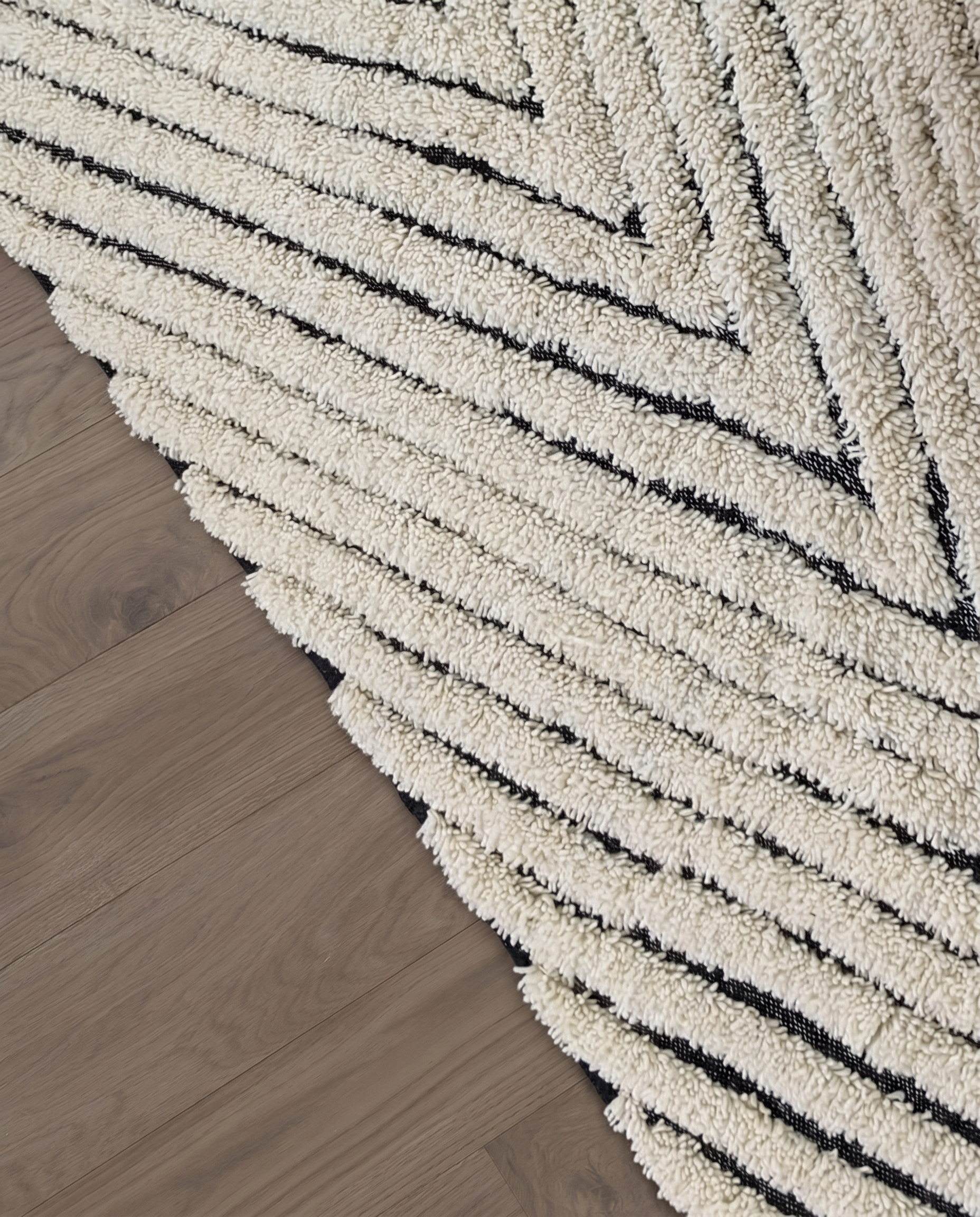 KARMA Azilal cream chevron lines Moroccan rug close-up showing hand-knotted wool texture and pile detail 2, by NURA