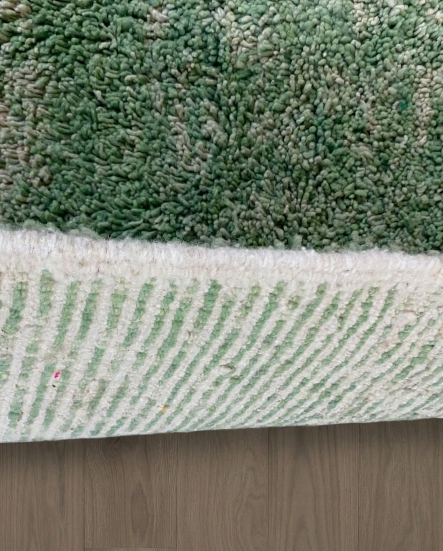 KHADIJA Beni Ourain sage abstract color block Moroccan rug close-up showing hand-knotted wool texture and pile detail 3, by NURA