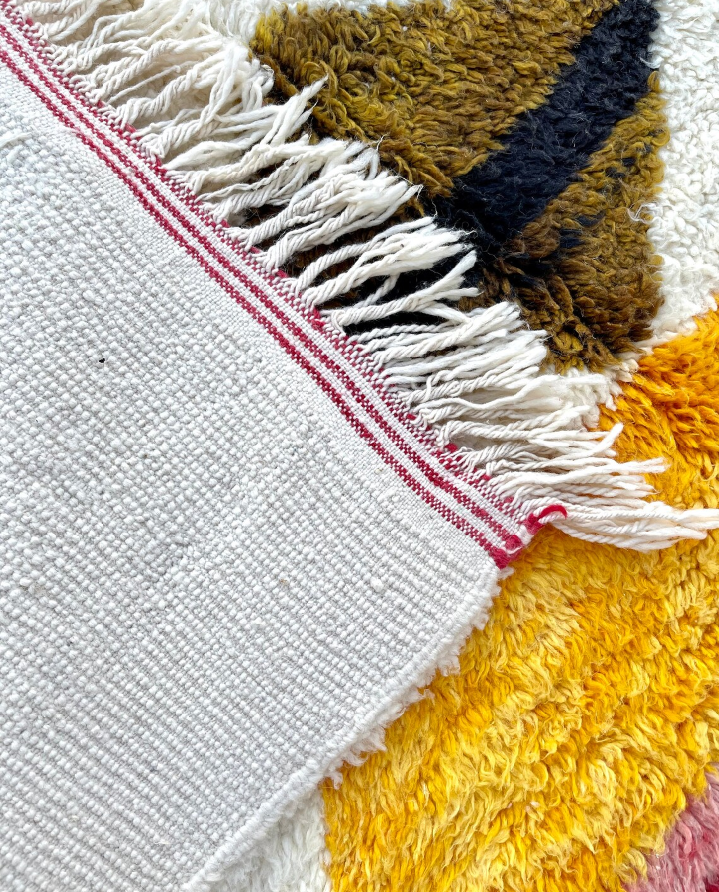 KHAWLA Azilal ivory abstract central motif Moroccan rug back view showing traditional handwoven construction, by NURA