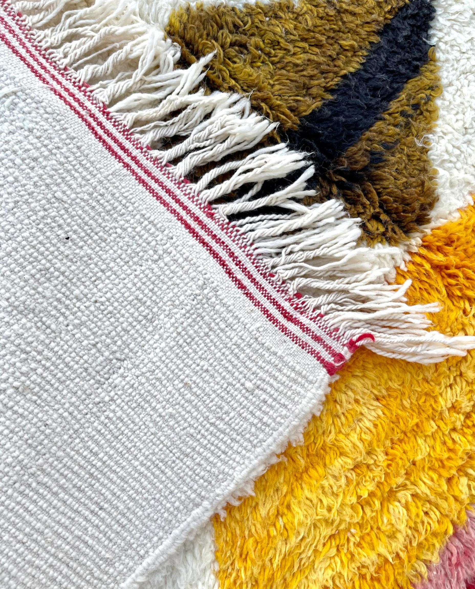 KHAWLA Azilal ivory abstract central motif Moroccan rug back view showing traditional handwoven construction, by NURA