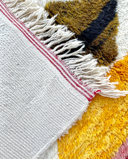 KHAWLA Azilal ivory abstract central motif Moroccan rug back view showing traditional handwoven construction, by NURA