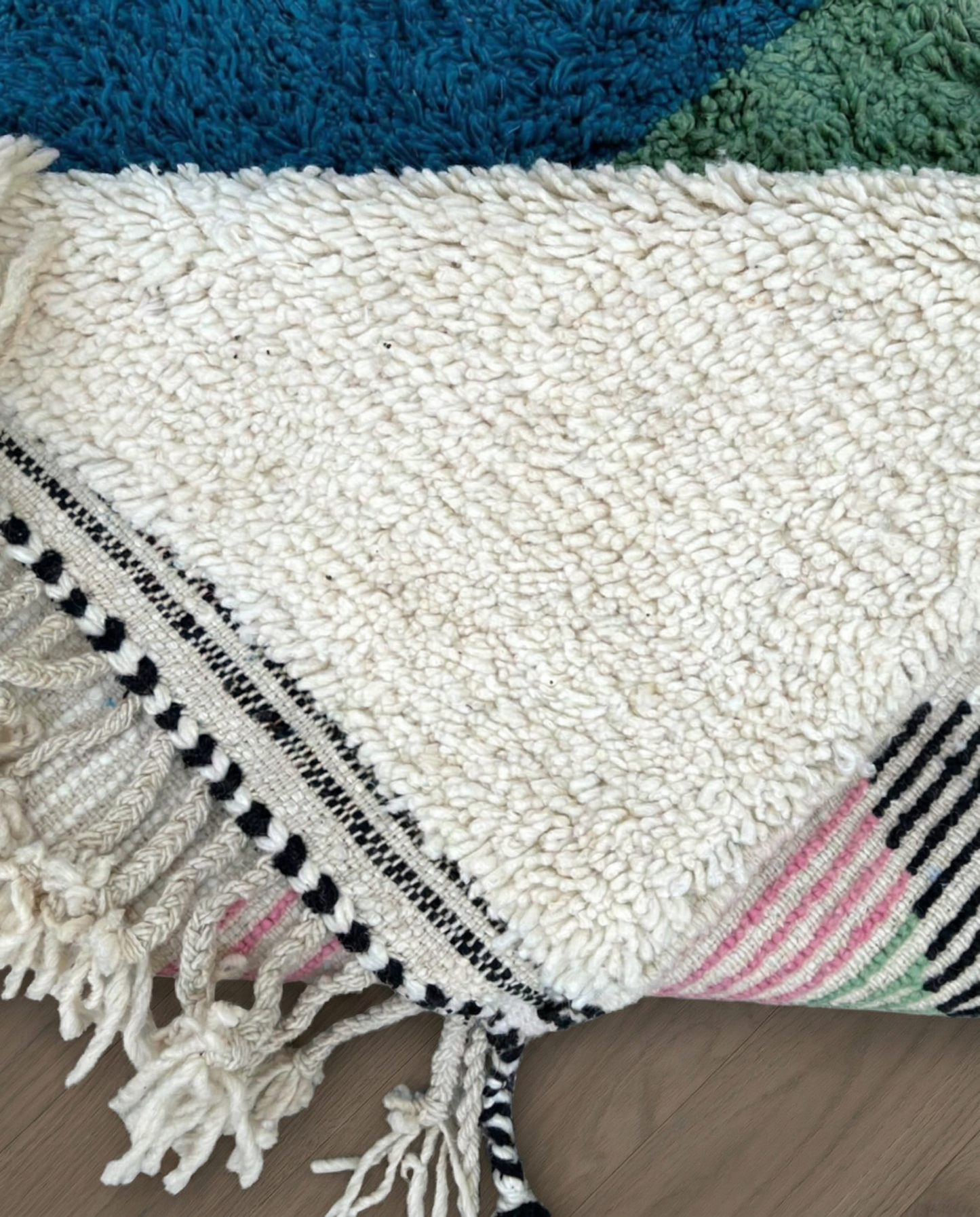 LAMIS Azilal ivory abstract color block Moroccan rug back view showing traditional handwoven construction, by NURA