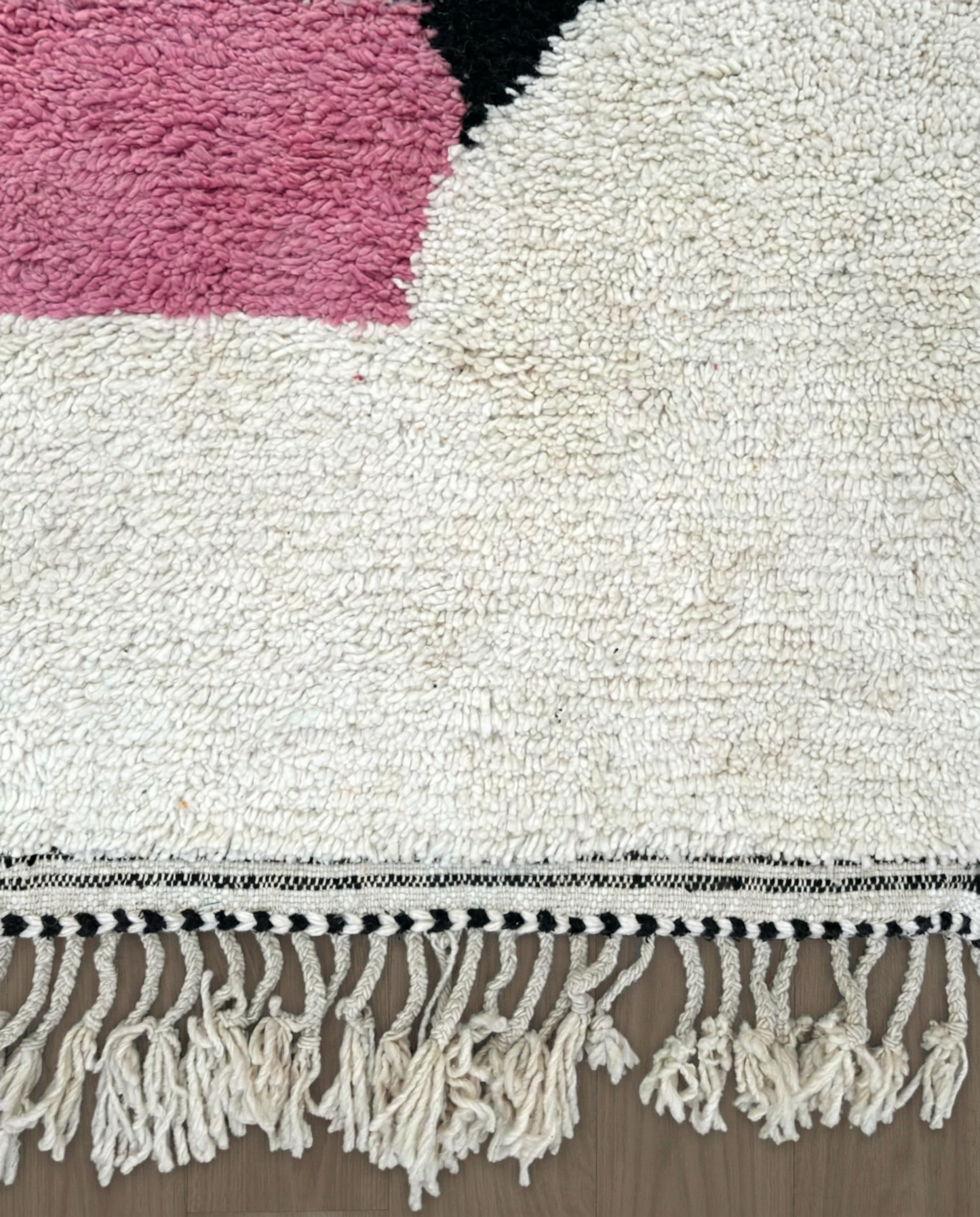 LAMIS Azilal ivory abstract color block Moroccan rug close-up of hand-tied fringe and kilim band detail, by NURA