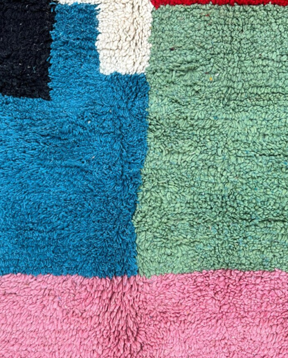 LAMIS Azilal ivory abstract color block Moroccan rug close-up showing hand-knotted wool texture and pile detail, by NURA