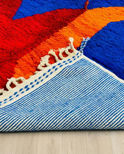 LANA Beni Ourain cobalt abstract color block Moroccan rug close-up of hand-tied fringe and kilim band detail, by NURA