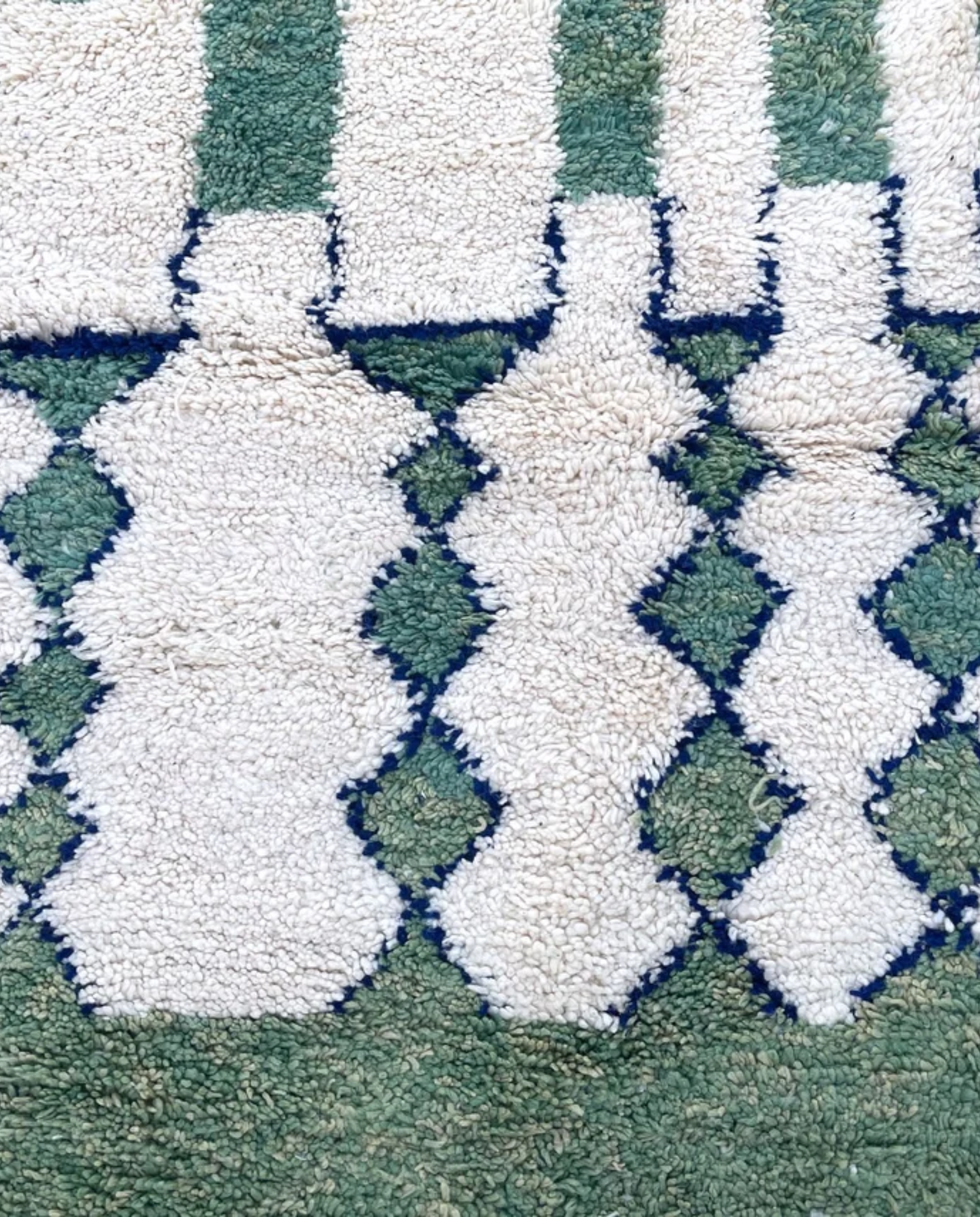LATIFA Beni Ourain green asymmetrical diamond lattice Moroccan rug close-up showing hand-knotted wool texture and pile detail 1, by NURA