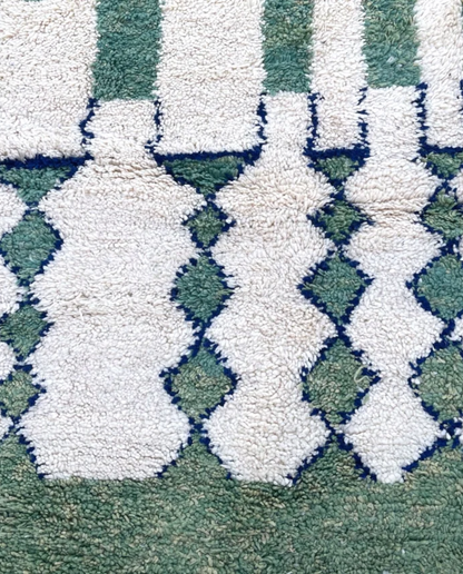LATIFA Beni Ourain green asymmetrical diamond lattice Moroccan rug close-up showing hand-knotted wool texture and pile detail 1, by NURA