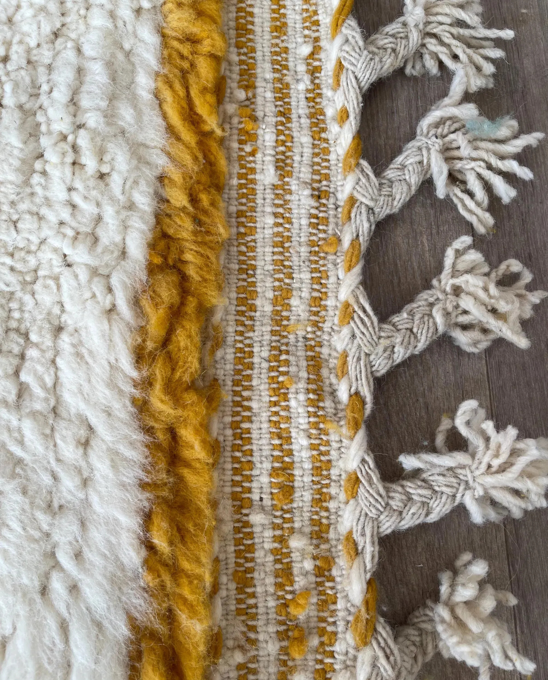 LEILA Boujad muted teal abstract color block Moroccan rug close-up of hand-tied fringe and kilim band detail, by NURA