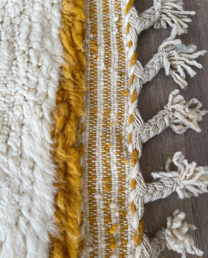 LEILA Boujad muted teal abstract color block Moroccan rug close-up of hand-tied fringe and kilim band detail, by NURA