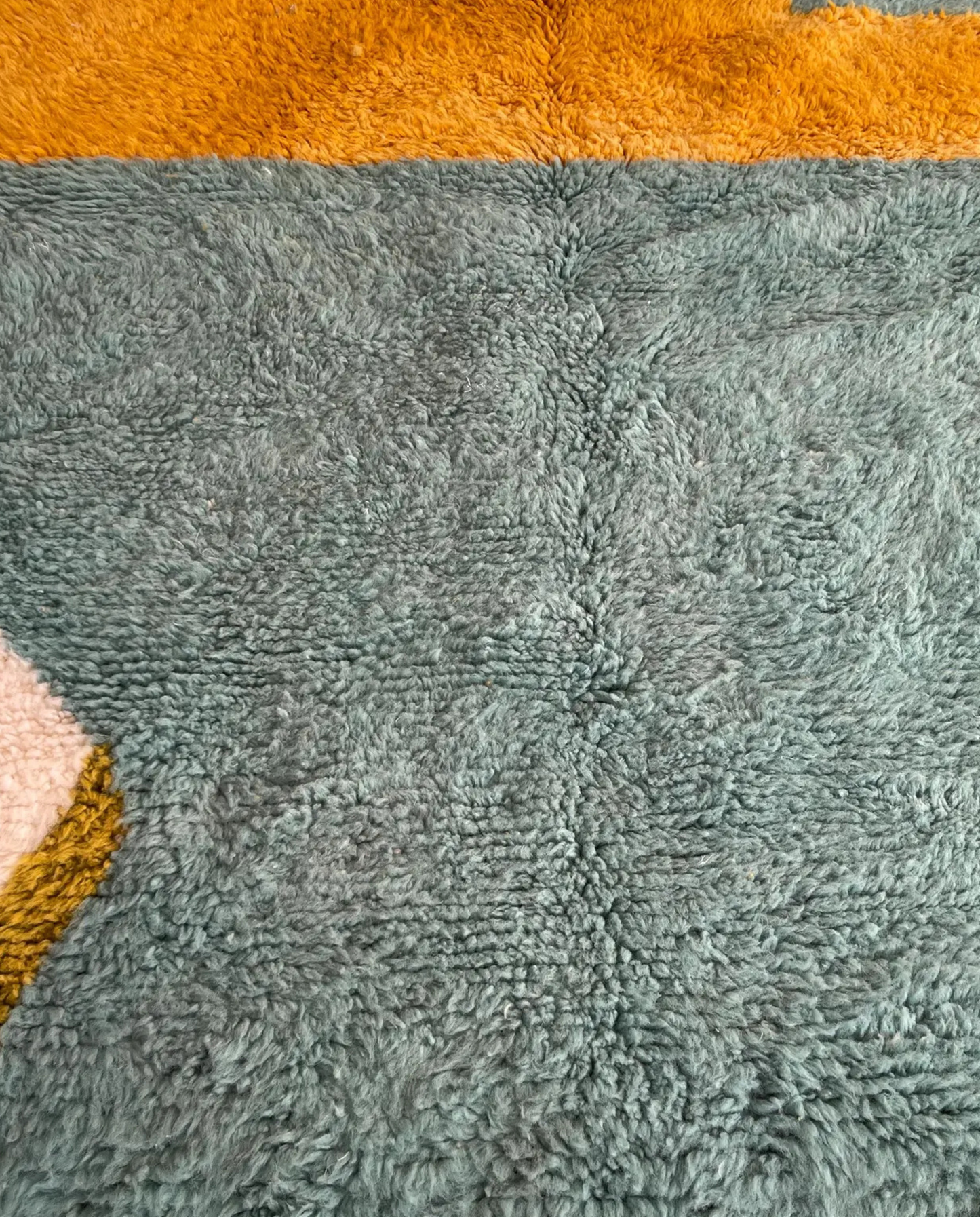 LEILA Boujad muted teal abstract color block Moroccan rug close-up showing hand-knotted wool texture and pile detail, by NURA