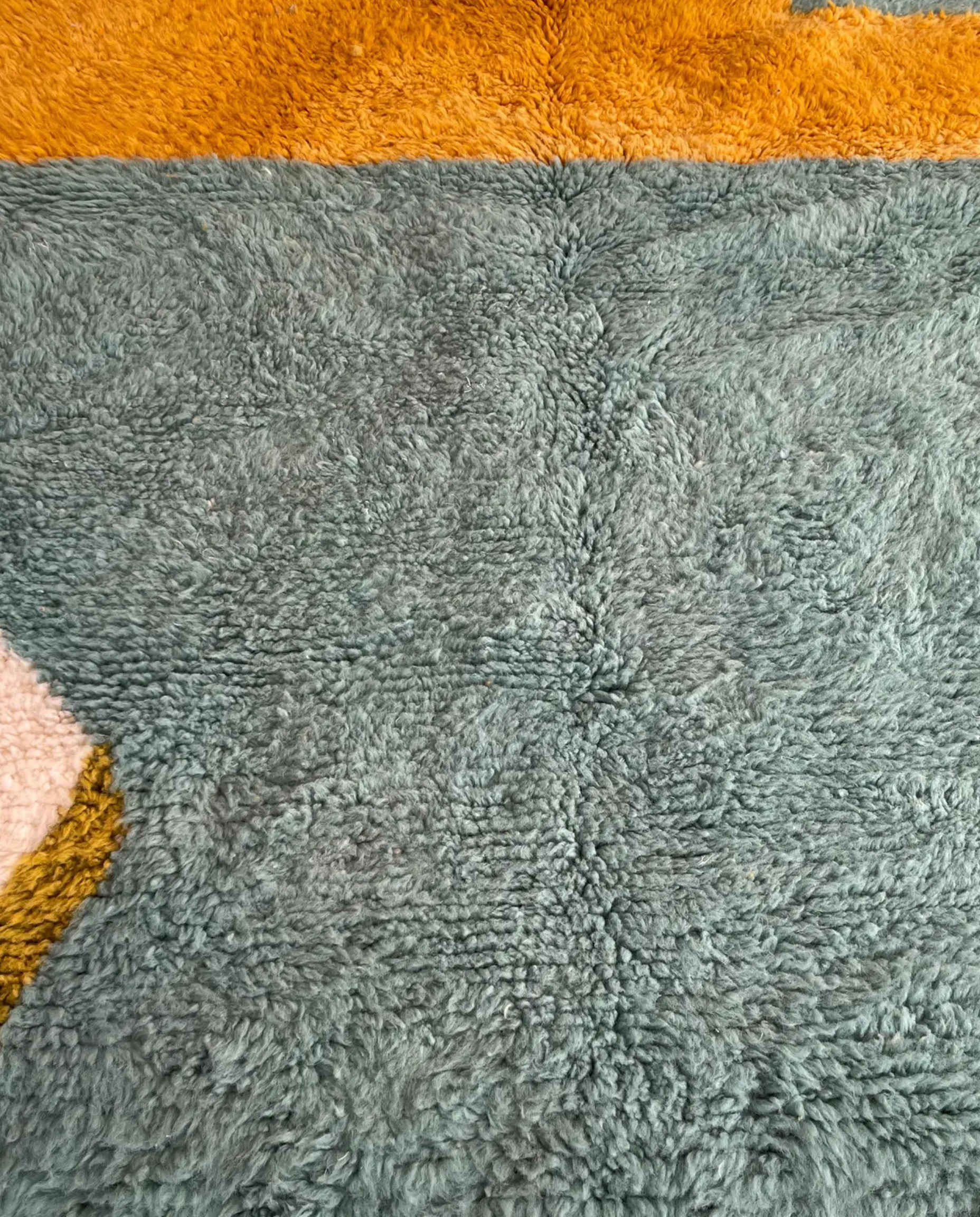 LEILA Boujad muted teal abstract color block Moroccan rug close-up showing hand-knotted wool texture and pile detail, by NURA