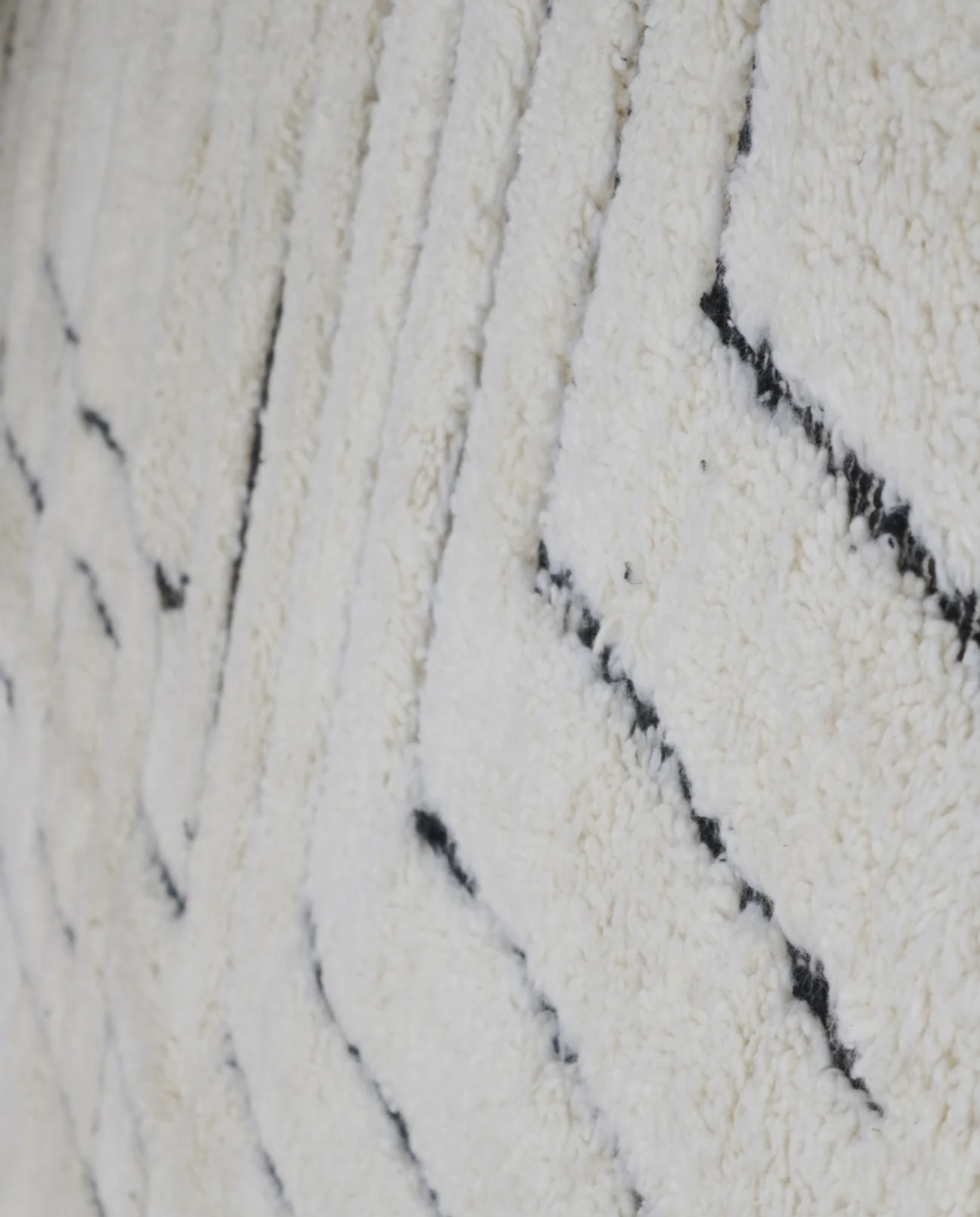 LILLA Beni Ourain cream maze motif Moroccan rug close-up showing hand-knotted wool texture and pile detail 1, by NURA