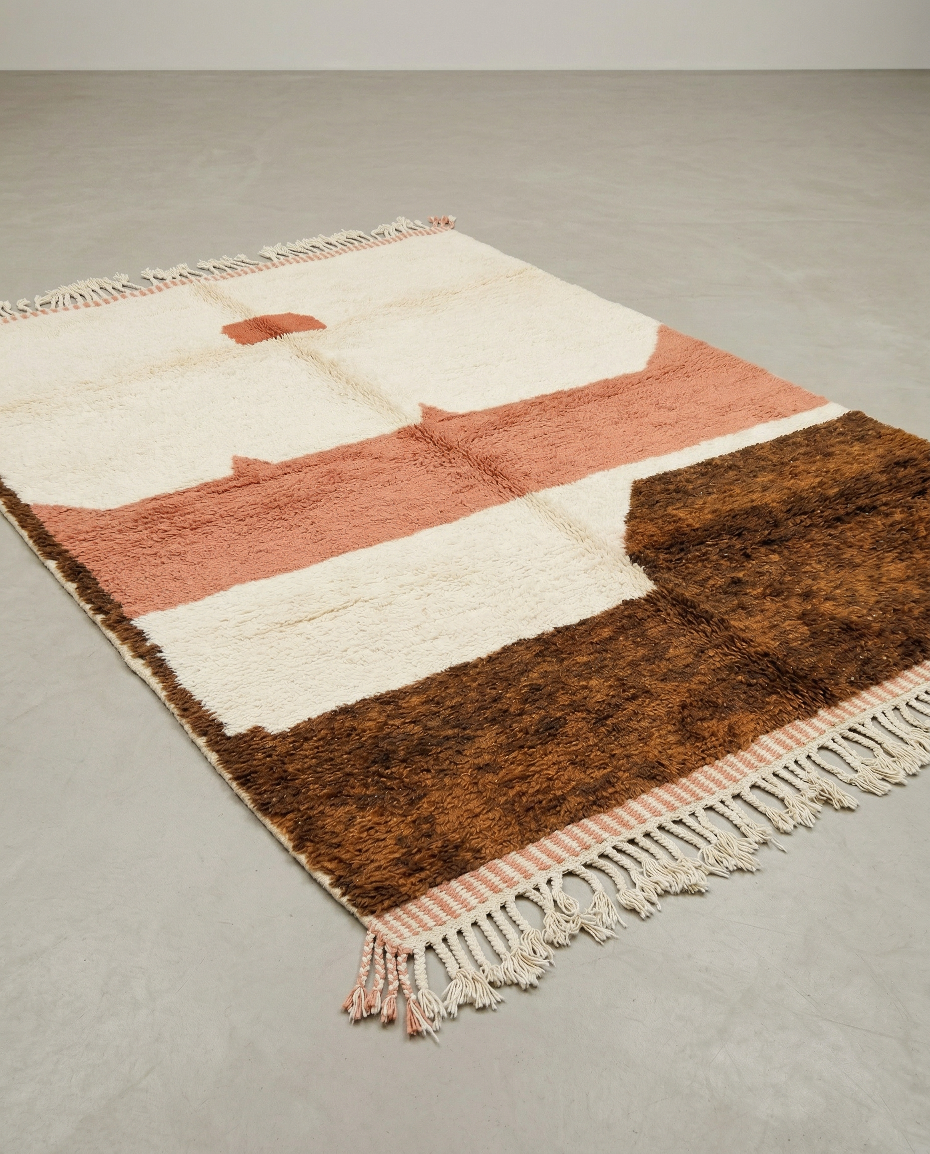LINA Azilal ivory abstract color block Moroccan rug displayed on a parquet wood floor, showing full fringe and edge detail, by NURA