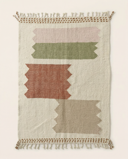 Flat-woven ivory Azilal Moroccan rug with large stepped color blocks in terracotta, sage, and blush, by NURA.