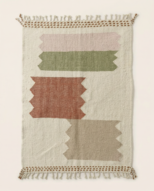 Flat-woven ivory Azilal Moroccan rug with large stepped color blocks in terracotta, sage, and blush, by NURA.