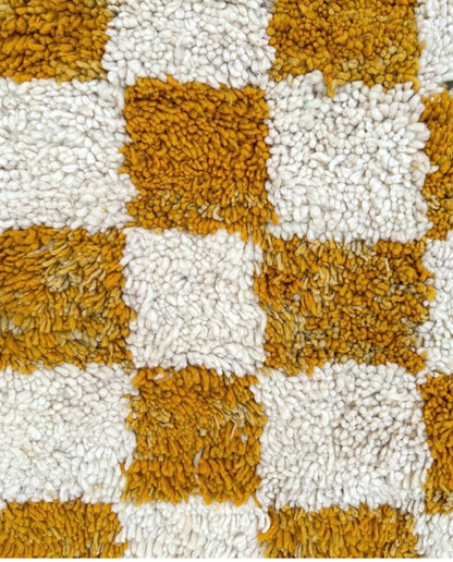 MAHA Beni Ourain mustard checker grid Moroccan rug close-up showing hand-knotted wool texture and pile detail, by NURA