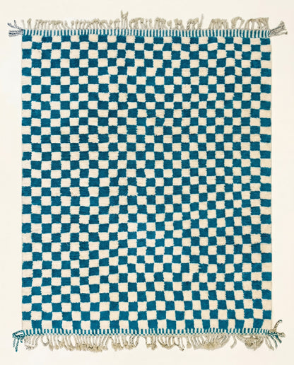 A plush blue and cream checkerboard Moroccan rug hand-knotted from virgin wool, shown flat from above by NURA.