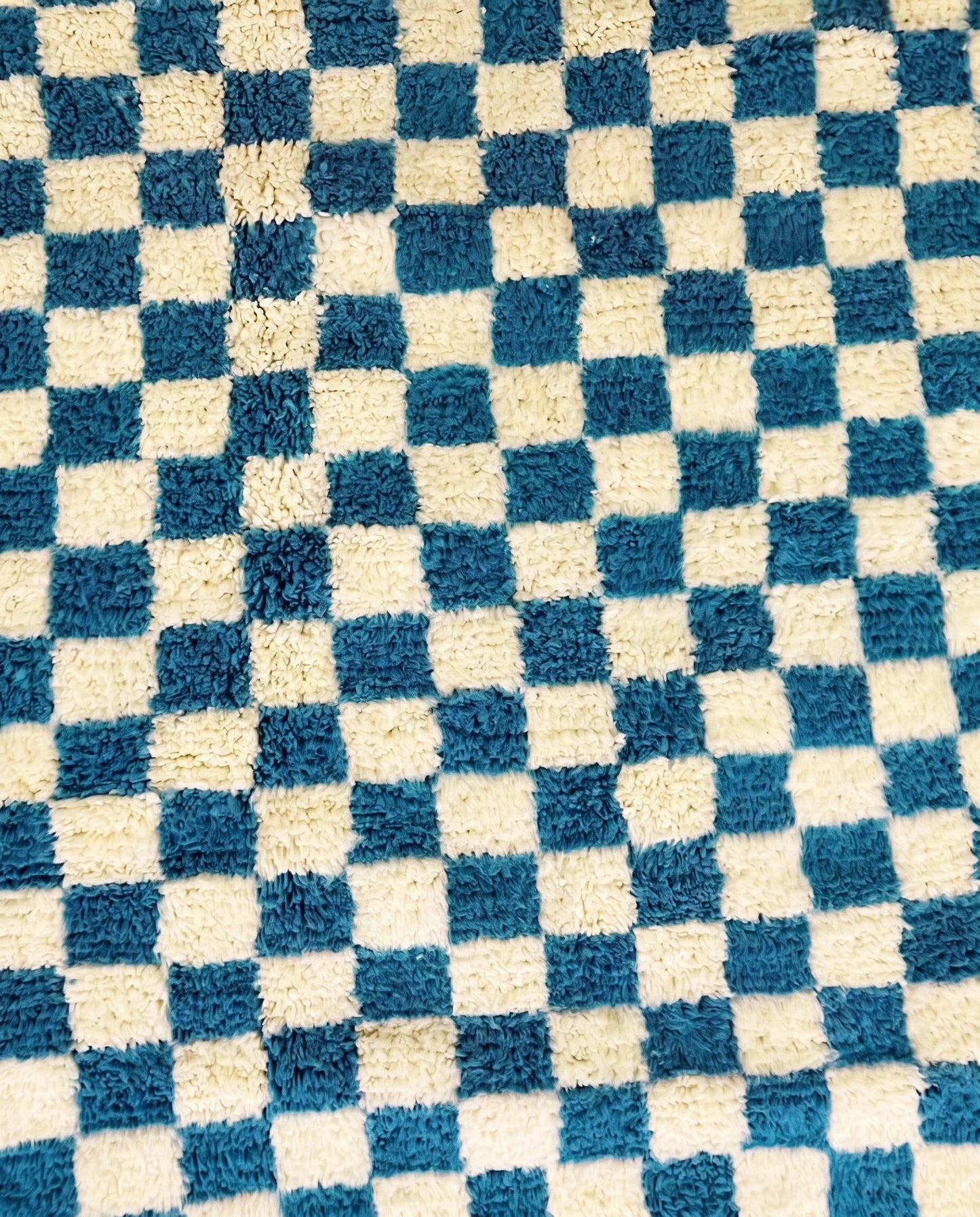 MAJDA Beni Ourain blue checker grid Moroccan rug close-up showing hand-knotted wool texture and pile detail 1, by NURA